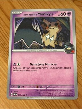 Team Rocket's Mimikyu Pokémon Trading Card (087/182)